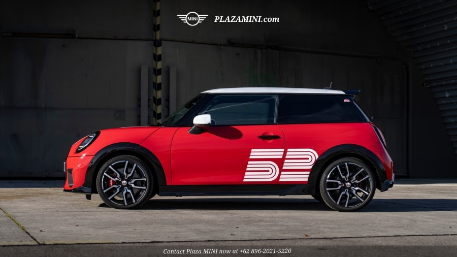 Side profile red MINI 3 Door JCW Victory Edition with bold 52 graphic and sport wheels
